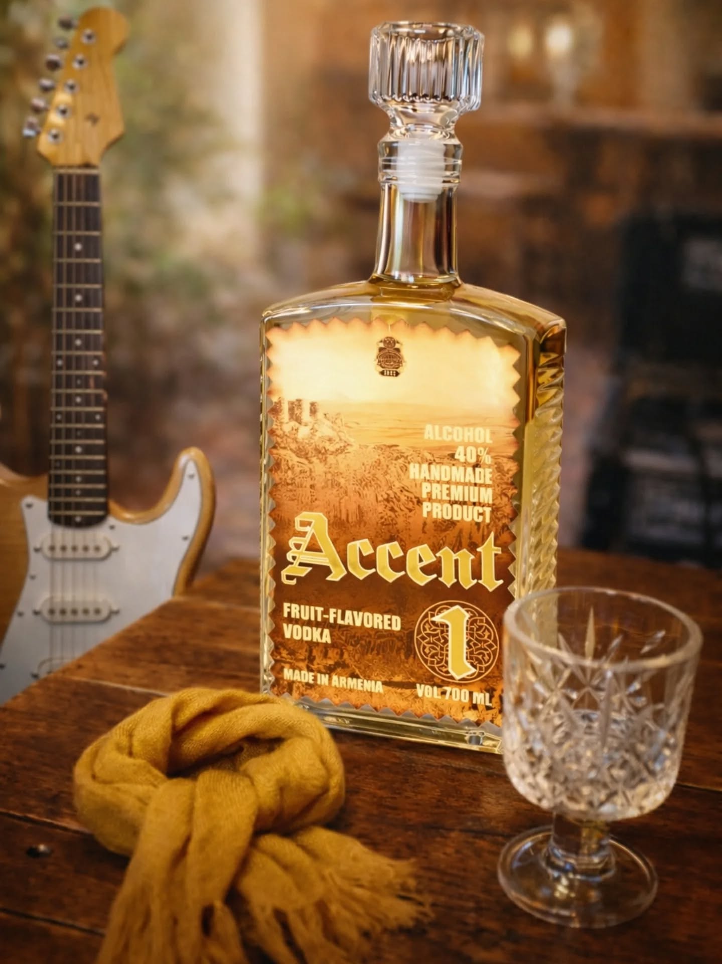 Accent 1 bottle on a wooden table next to a guitar